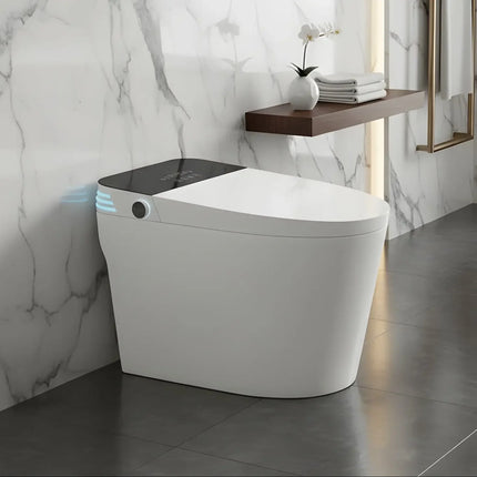 Modern white smart toilet with black top and blue sensor light in sleek marble bathroom