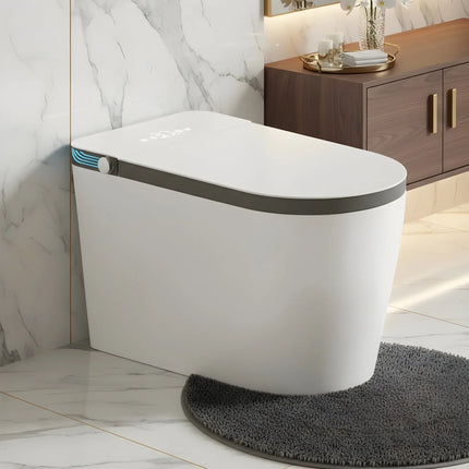 Modern white smart toilet with blue LED display in marble bathroom, grey rug, wooden cabinet